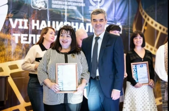 Victoria Garmashova holding her 2023 Native Paths finalist diploma